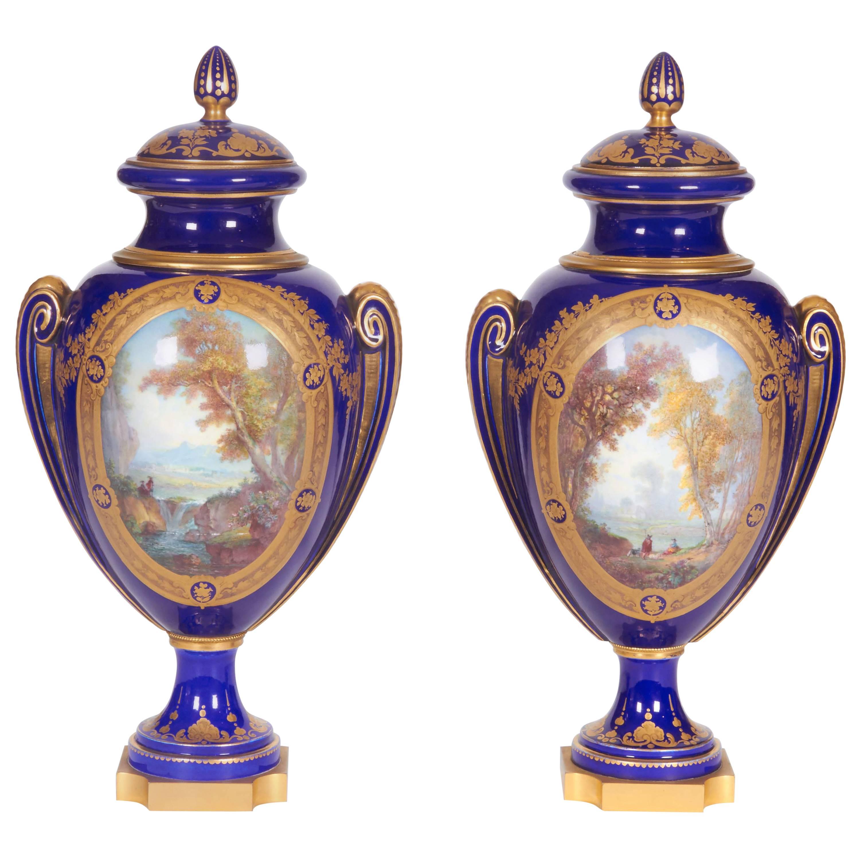 Pair of Napoleon III Sevres Porcelain Cobalt Blue Vases and Covers on Ormolu