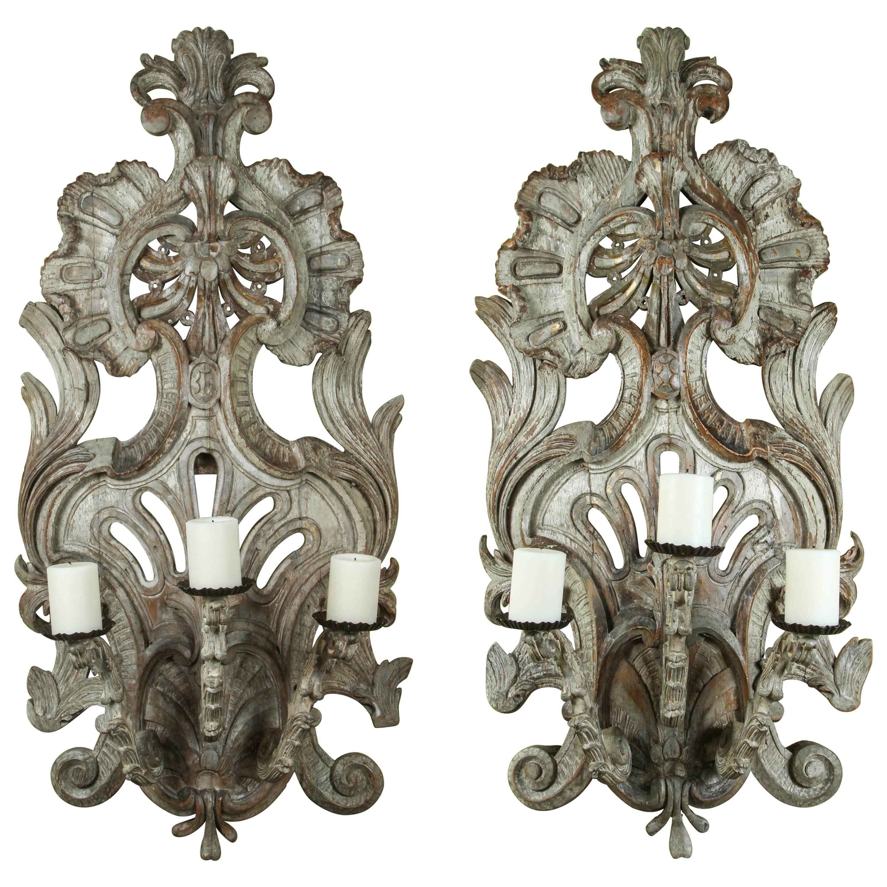 A Pair of 18th Century Italian Carved and Painted Three Candle Appliques