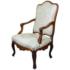 A French  Fauteuil Walnut Chair, 18th Century, newly reupholstered 