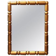 Bold Mid-Century Modern Gilded Mirror with Spheres and Cylinders