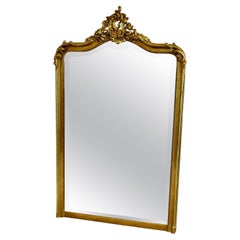 A Large French Rococo Gilt Console Mirror Decorated with Leaves and Scrolls