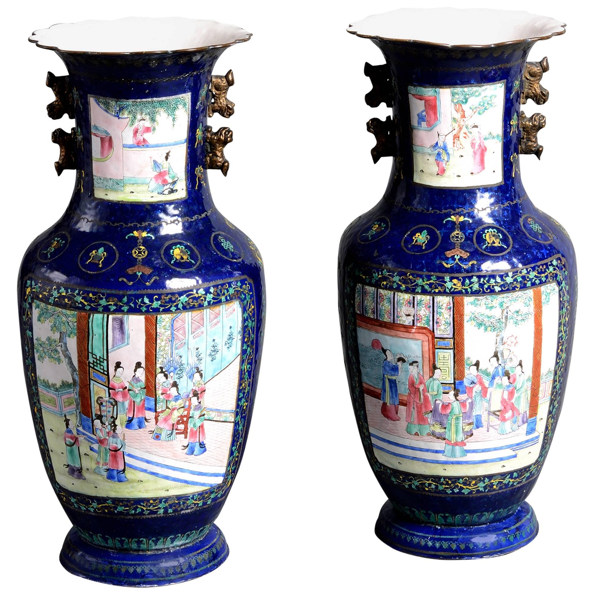 Pair of 19th Century Canton Dark Blue Enamel Vases with figurative court scenes
