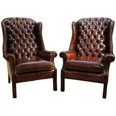 Pair of Deep Buttoned Leather Upholstered Edwardian Wing Chairs