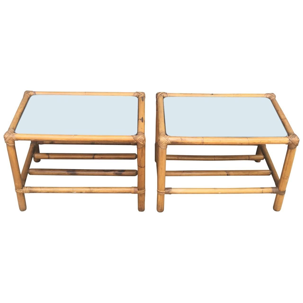 Charming pair of two-tier tables each with a mirror glass tops.