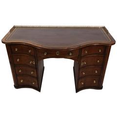 Antique Small English Mahogany Desk with Embossed Leather Top and Brass Gallery