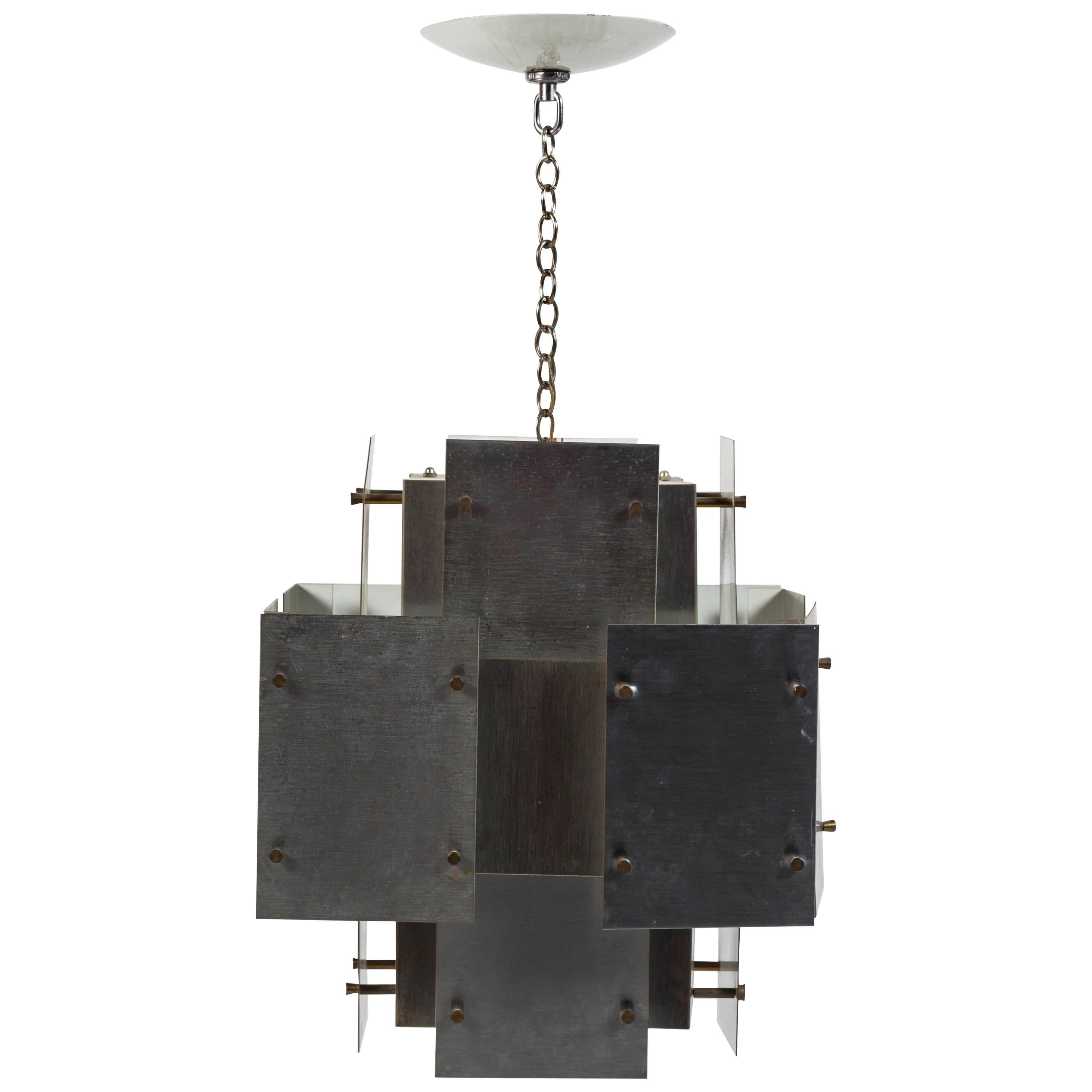 Constructivist light fixture with polished steel plates and brass pin fittings by Gaetano Sciolari. 1960s, Italian. Chain drop is 10