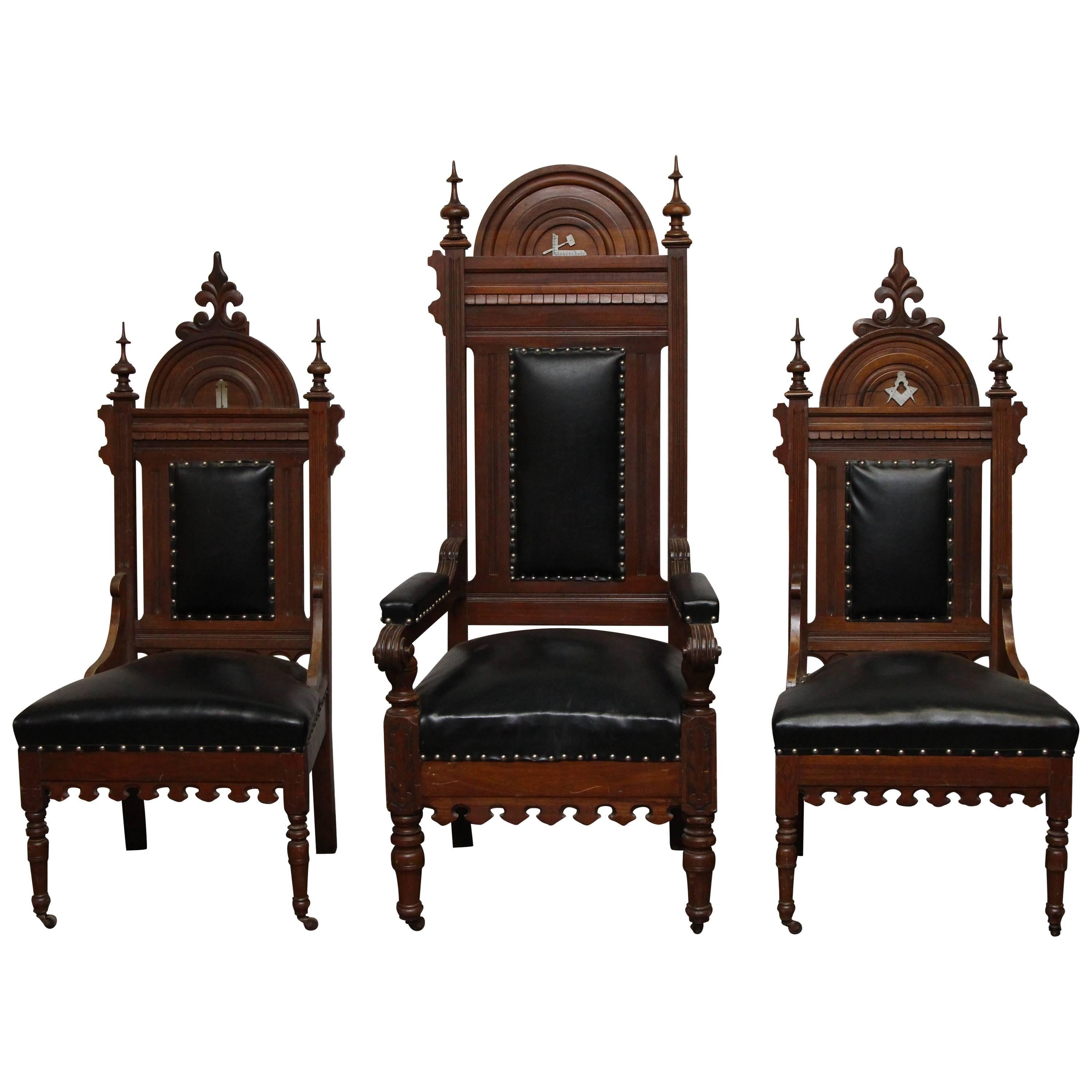 Set of Three Ornate Black Leather and Wood Masonic Chairs and Studded Details