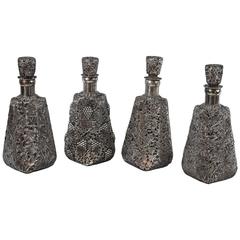 Set of Four Glass Decanters with Silver Overlay