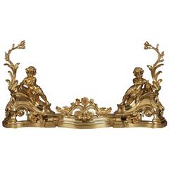 Chenets en bronze doré de style Louis XV avec putti