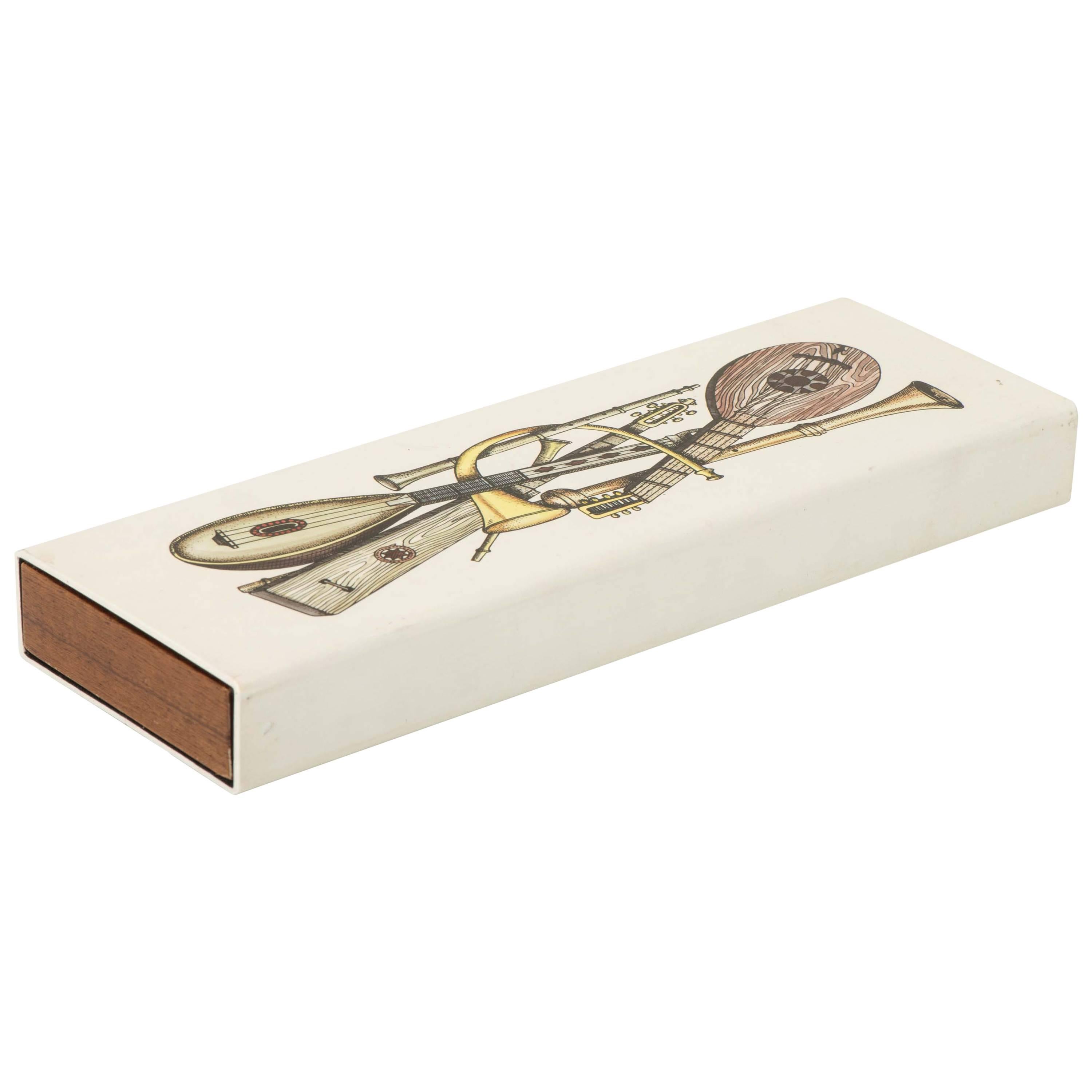 Atelier Fornasetti metal and mahogany box "Strumenti Musicali", Italy circa 1990 For Sale