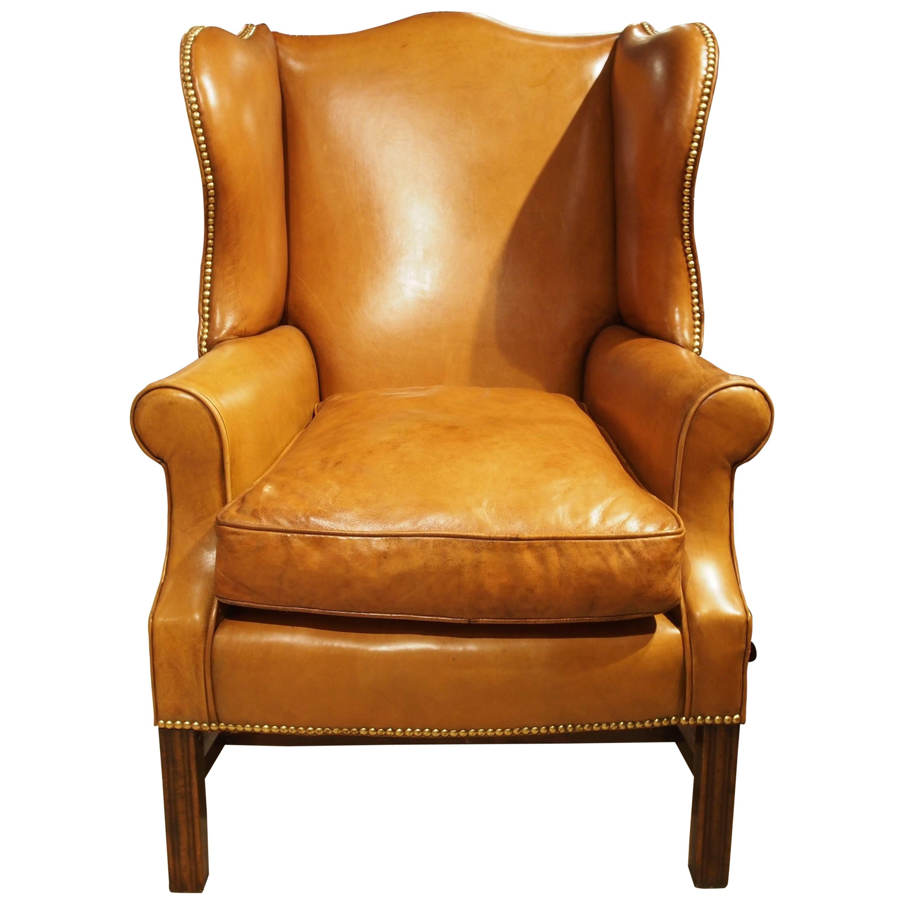 Wing Chair in Light Tan Leather with Brass Nailheads For Sale