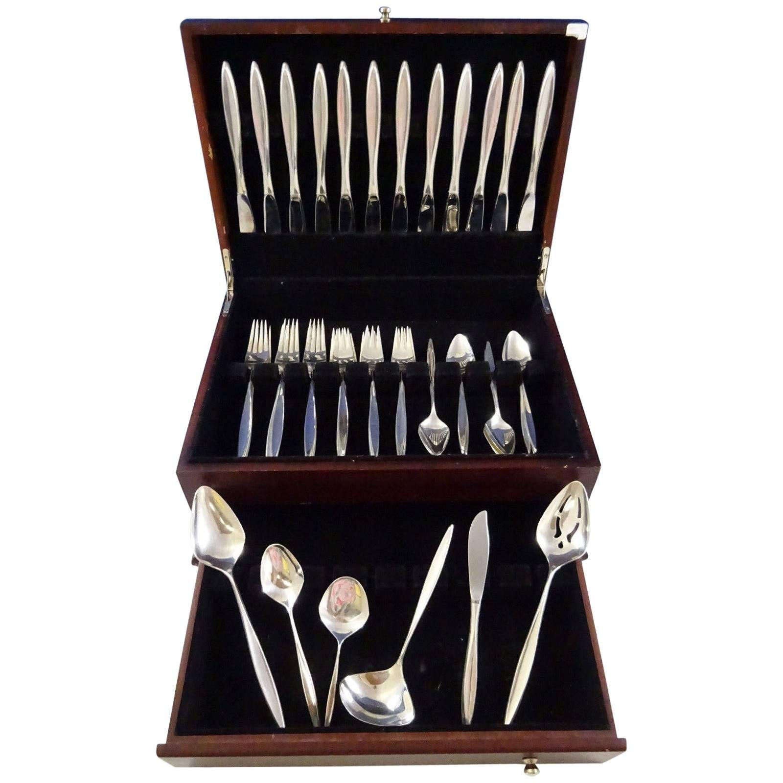 Mid-Century Modern Crystal by International sterling silver flatware set of 54 pieces. This set includes:

12 knives, 9 1/4