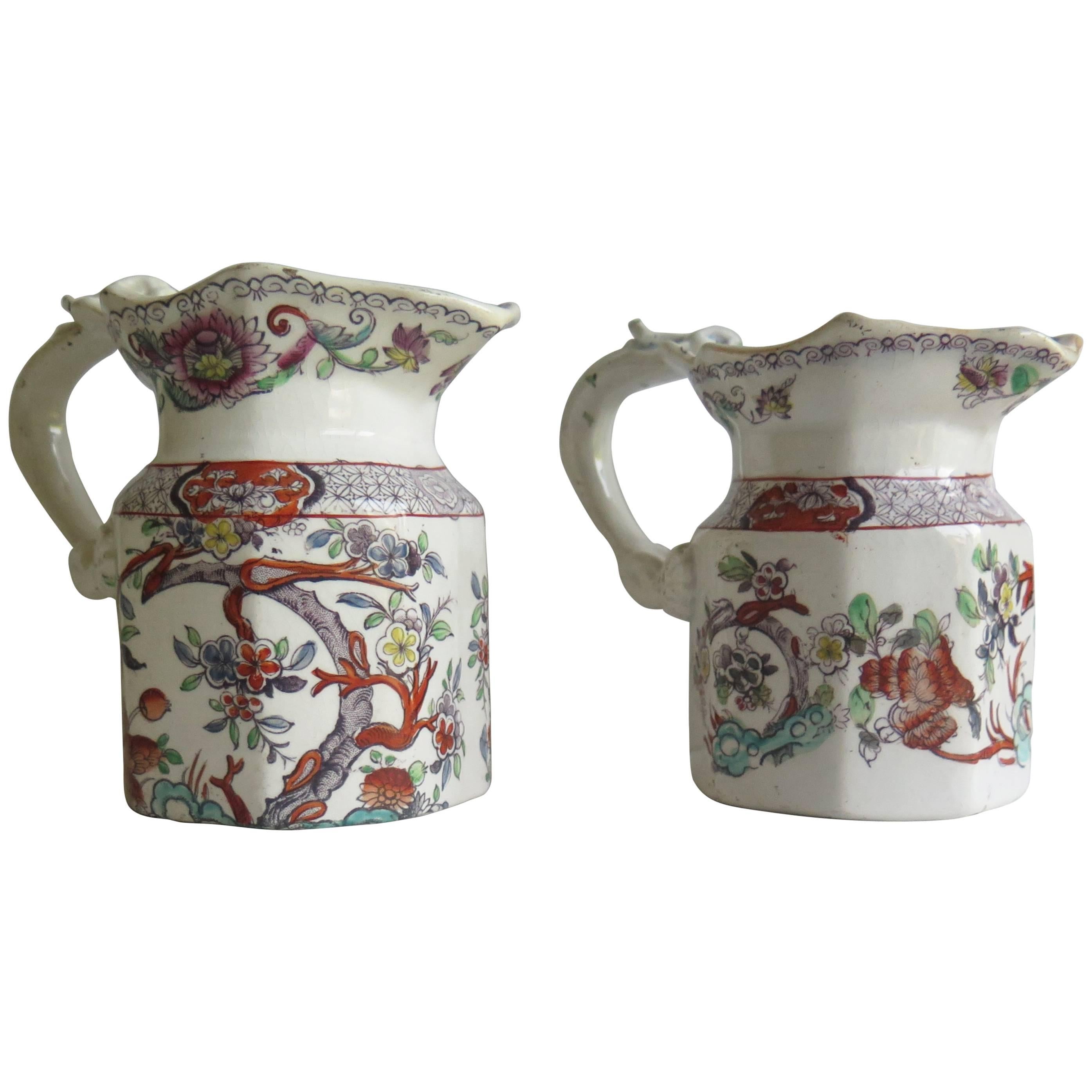 These are a good pair of ironstone pottery jugs or pitchers made by Mason's, of Lane Delph, Staffordshire, England, circa 1840. The shape, pattern and base markings are all rare. Please note; one jug is slightly larger than the other, the larger one