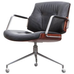 1960's brown wood and black leather Swivel Chair by Fabricius and Kastholm 'e'