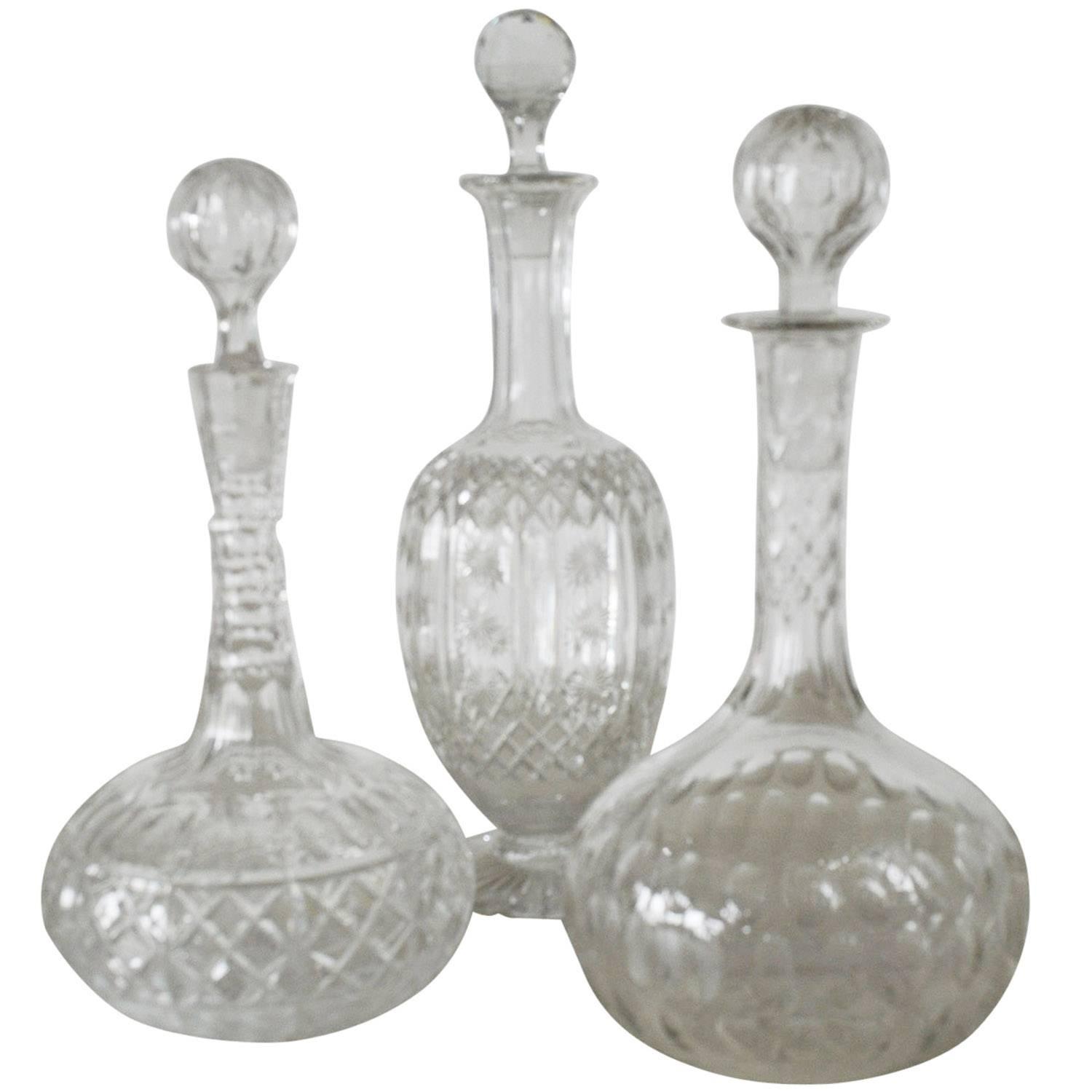 Group of Three Antique Cut Glass or Crystal Decanters, English, circa