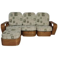 Paul Frankl Designed Rattan "Pretzal" Four-Piece Sofa and Ottoman with Cushions