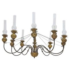 English Victorian Ten-Light Chandelier in Brass with Glass Chimneys, circa 1870