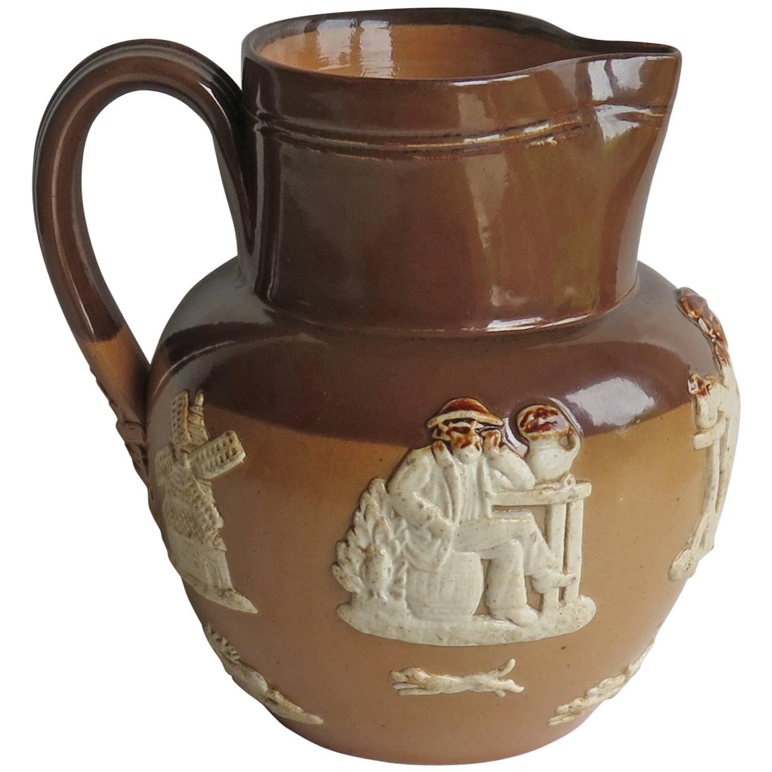 Royal Doulton Stoneware Jug or Pitcher moulded Farming Scene, Edwardian Ca 1905 For Sale