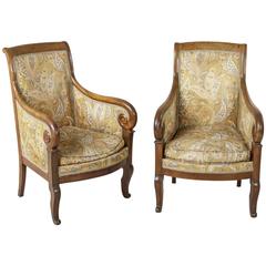 Pair of French Restauration Period Walnut Bergeres