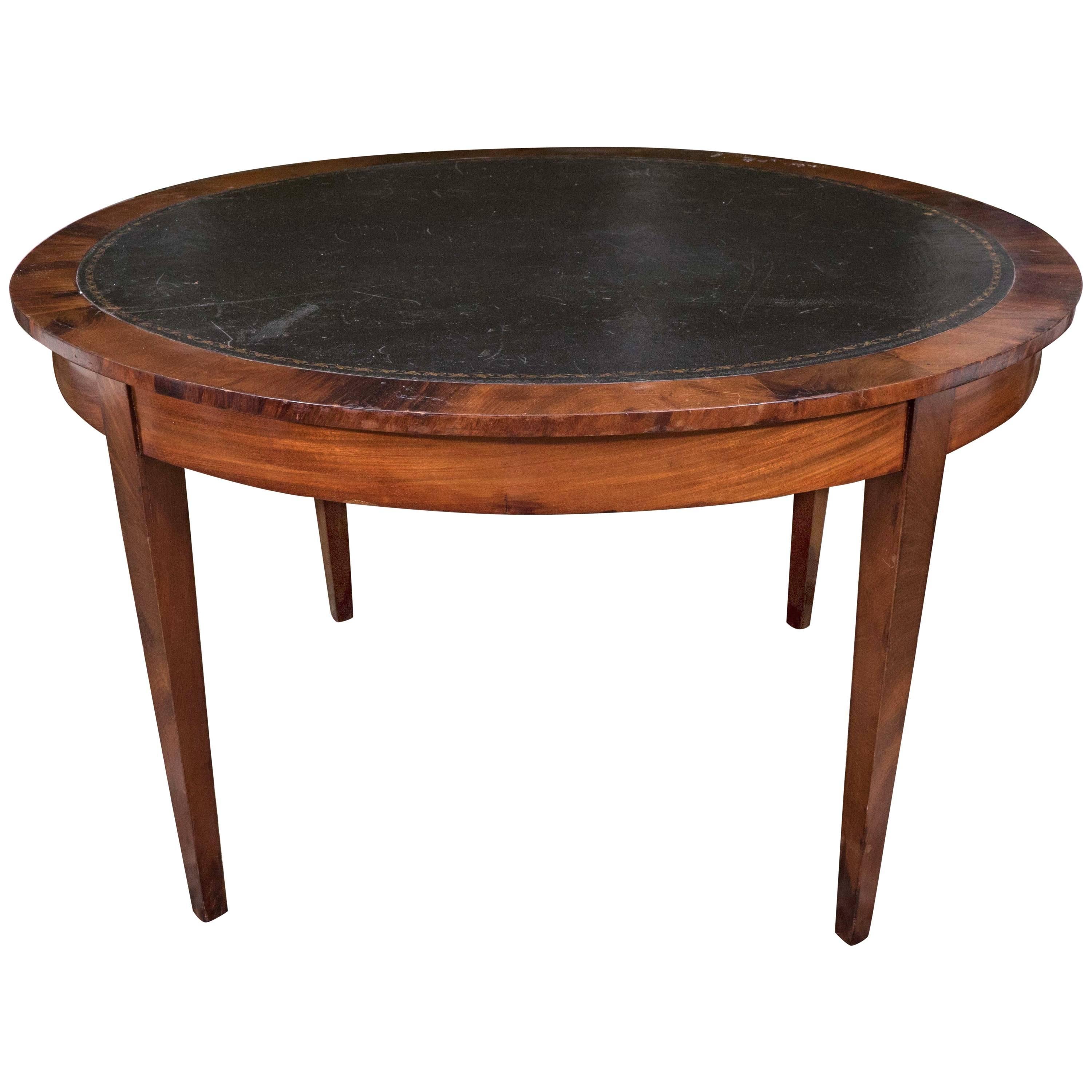 A 19th-Century Mahogany Table with Black Leather Top