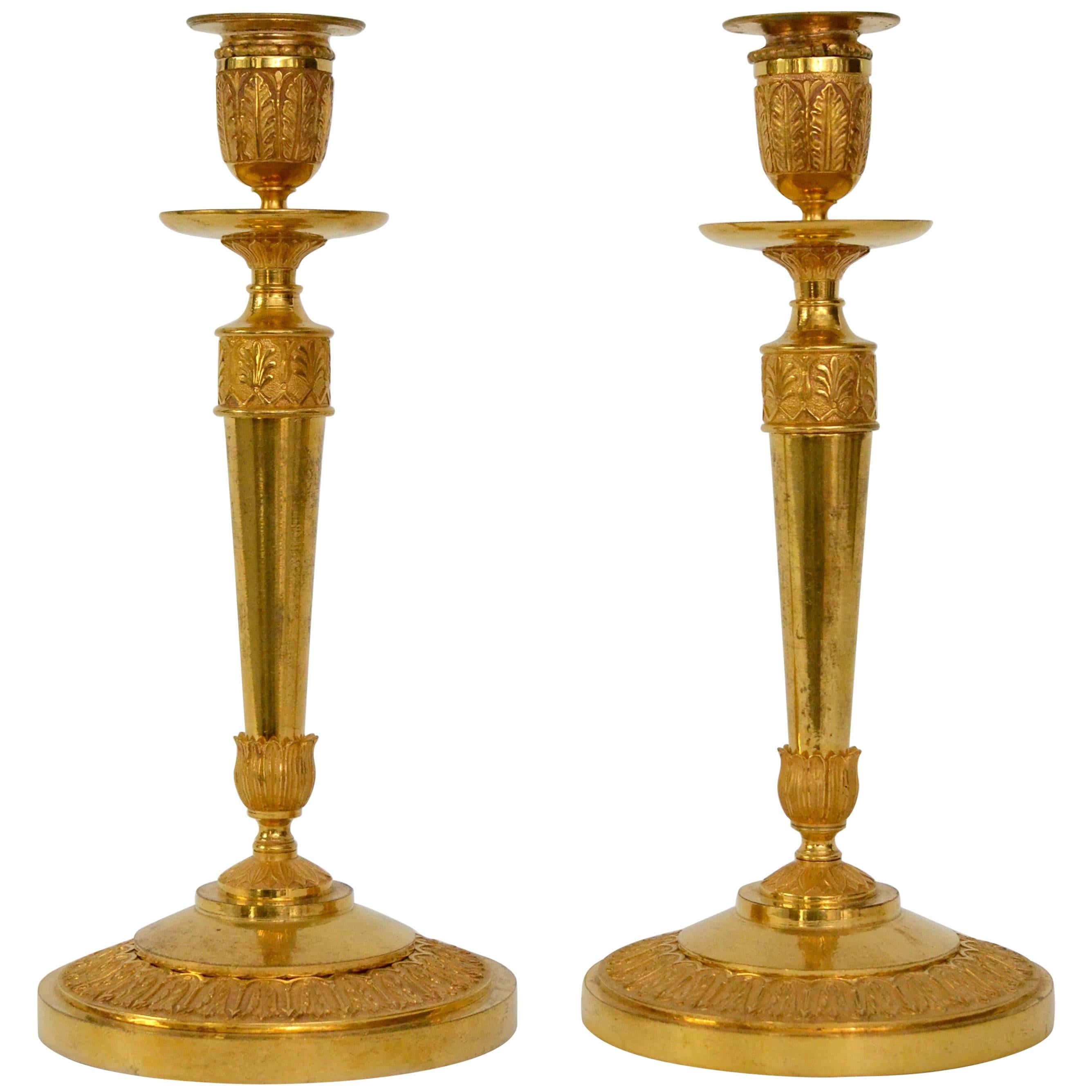 Pair of Early Empire Gilt Bronze Candlesticks