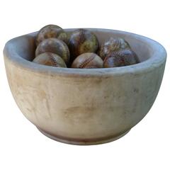 Mortar Bowl of Antique Stone with Display of Well-Worn Baseballs