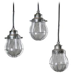 Industrial Pendant Light with Cage and Glass Globe