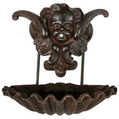 19th Century French Oiled Iron Wall Mounting Water Fountain with Putti and Shell
