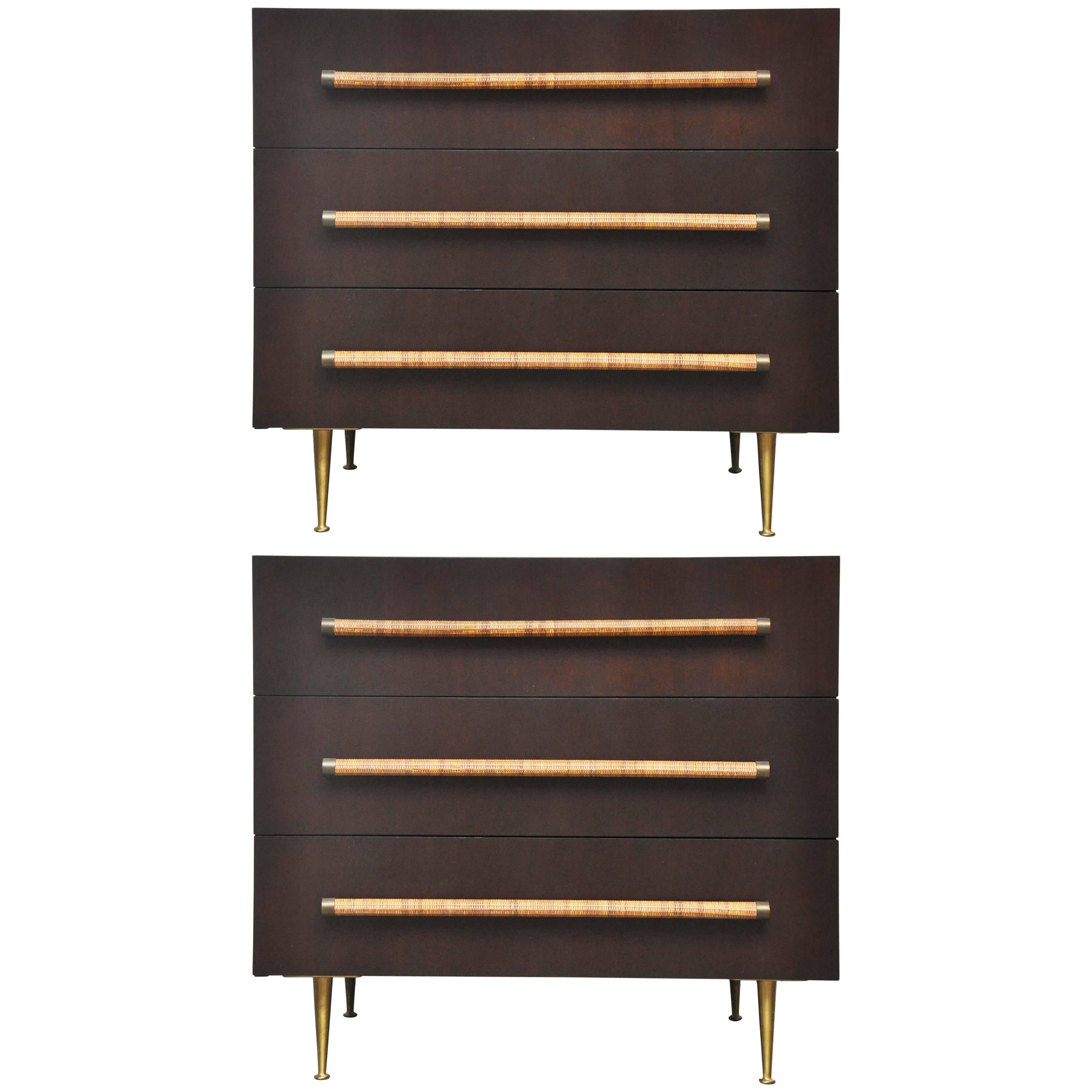 Rare pair of three-drawer chests by T.H. Robsjohn-Gibbings. Refinished espresso tone cases with brass legs and details, cane wrapped pulls. Classic beauties, circa 1950s.