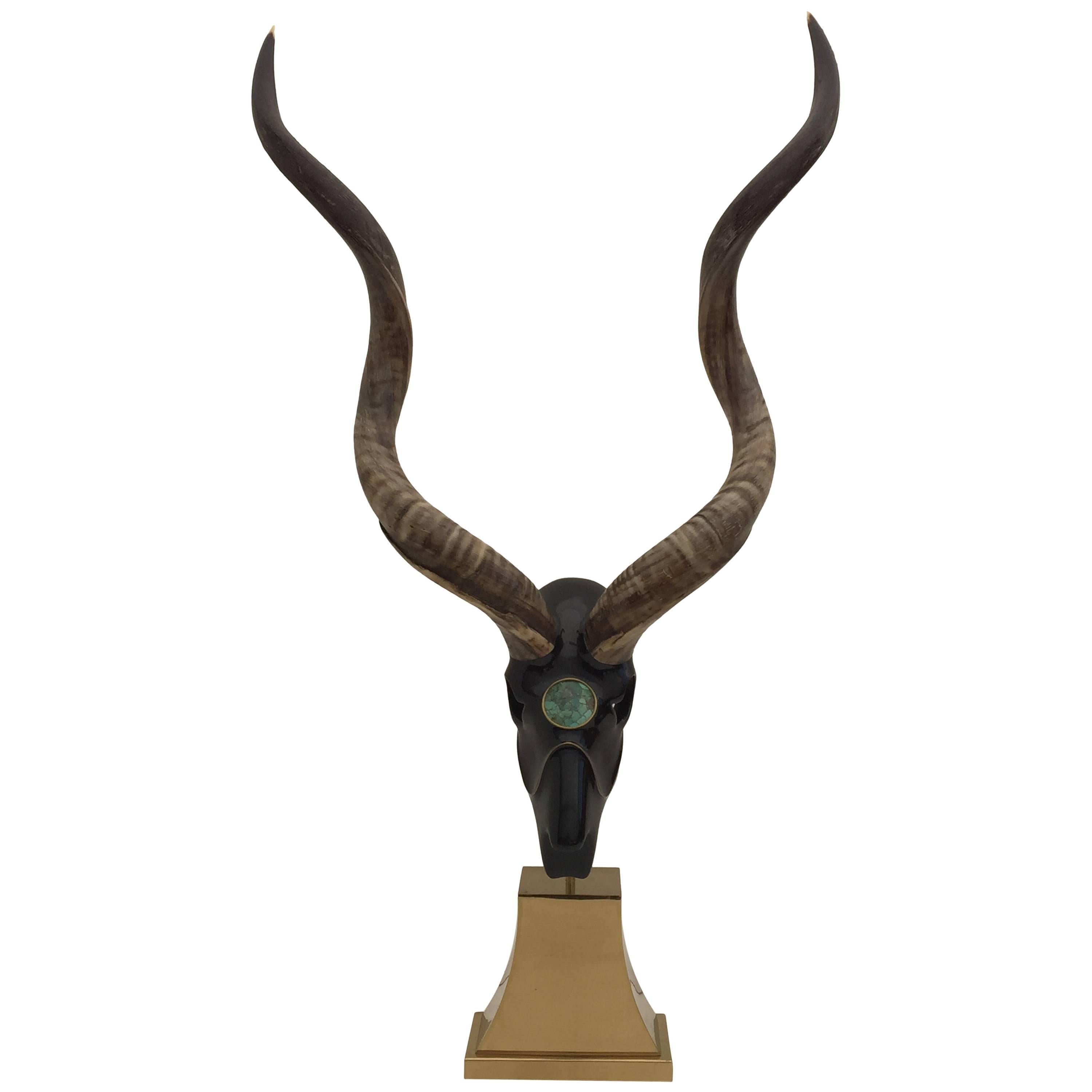 Jonson & Marcius designed kudu skull sculpture. Beautifully designed and made of cast resin skull, mounted with malachite cabochon with brass surround. 

 