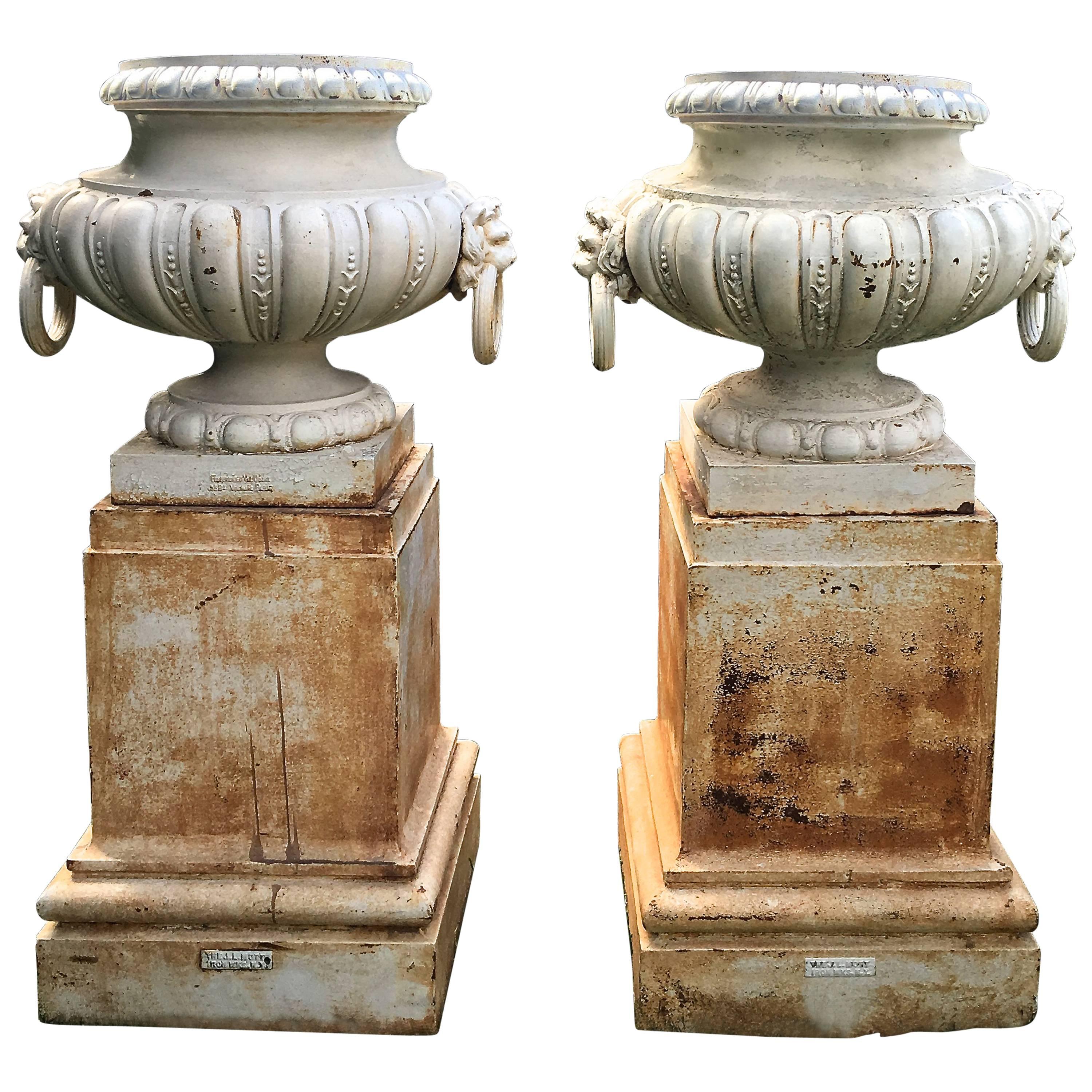 Pair of Rare Estate-Sized Val d'Osne Cast Iron Urns on Tall Plinths