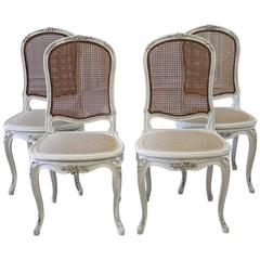 Set of Four Louis XV Style French Painted Cane Back Dining Chairs