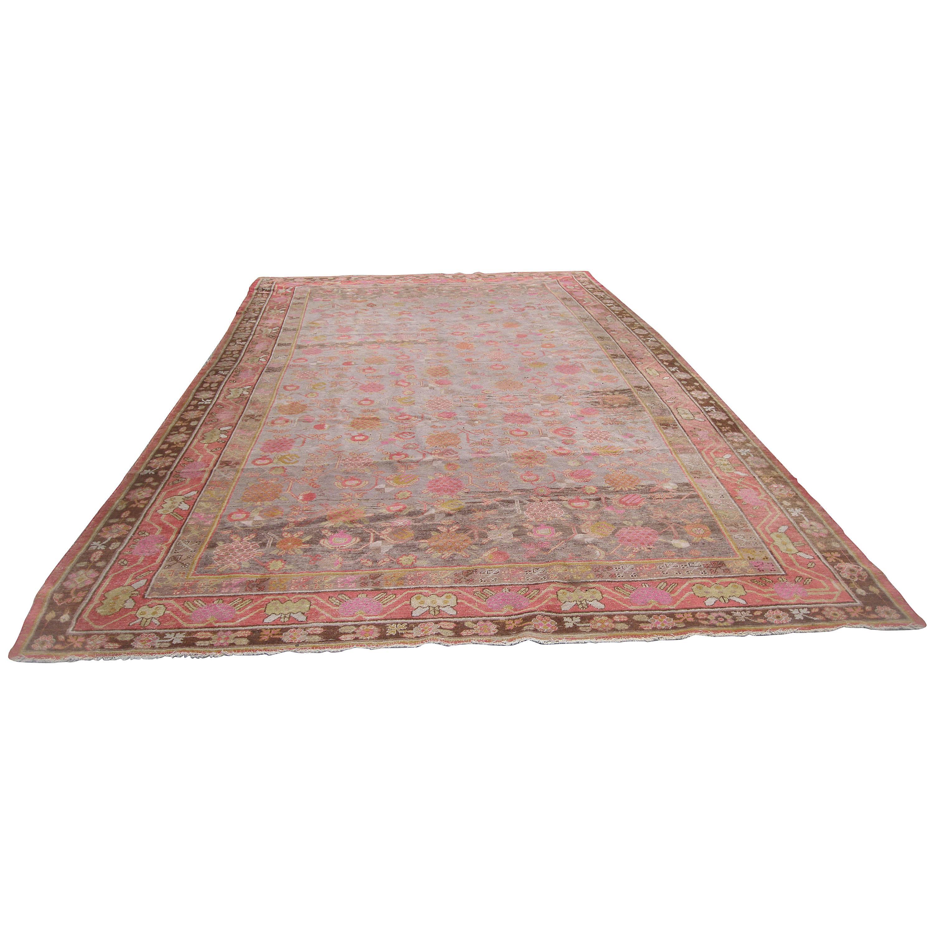 Antique Khotan Rug with Eight Band Border in Browns and Oranges For Sale