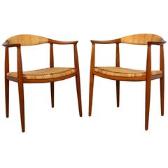 Hans Wegner Pair of "Round" Chairs in Teak and Cane