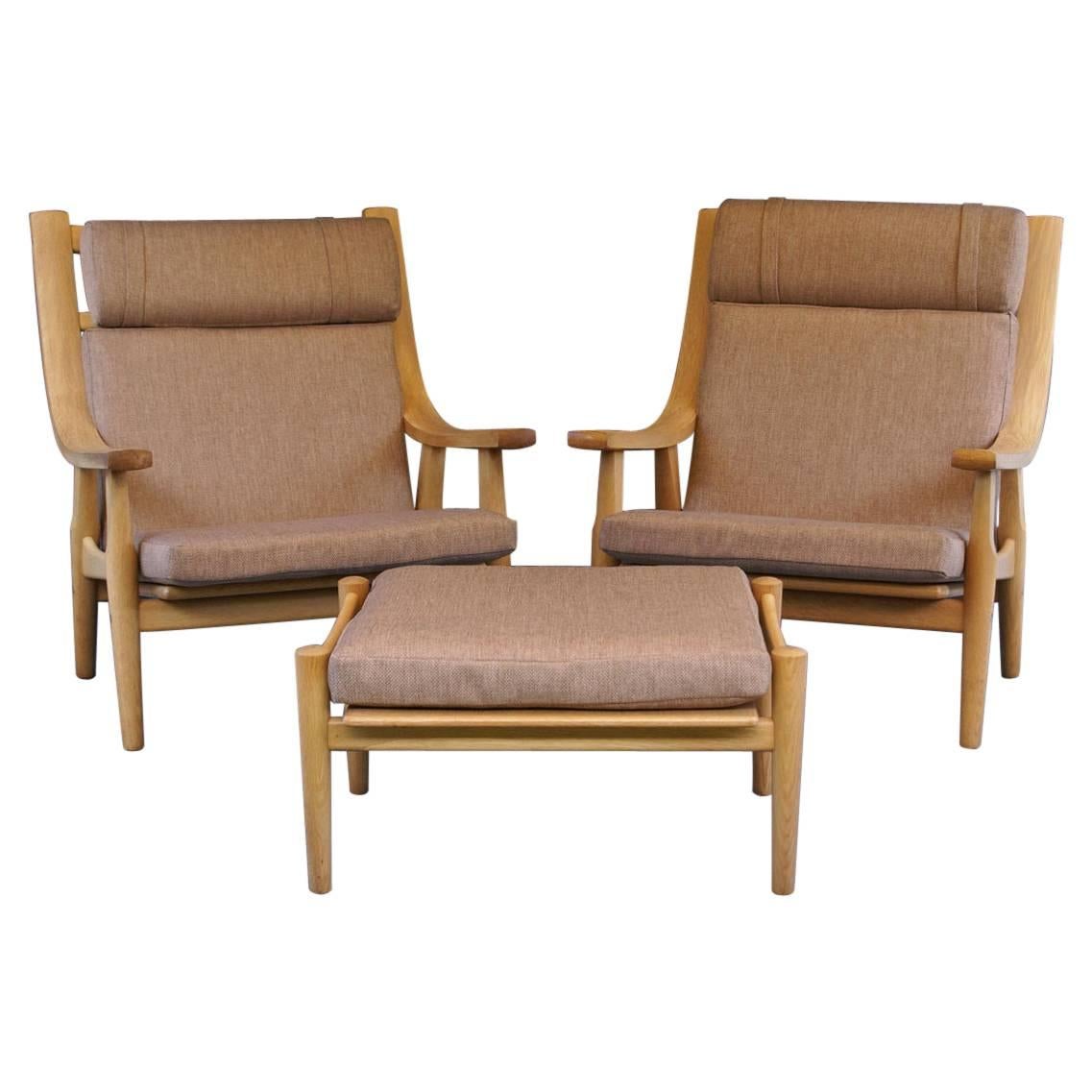 Pair of High Back Oak GE530 Chairs with Ottomans by Hans J. Wegner for GETAMA