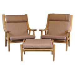 Pair of High Back Oak GE530 Chairs with Ottomans by Hans J. Wegner for GETAMA