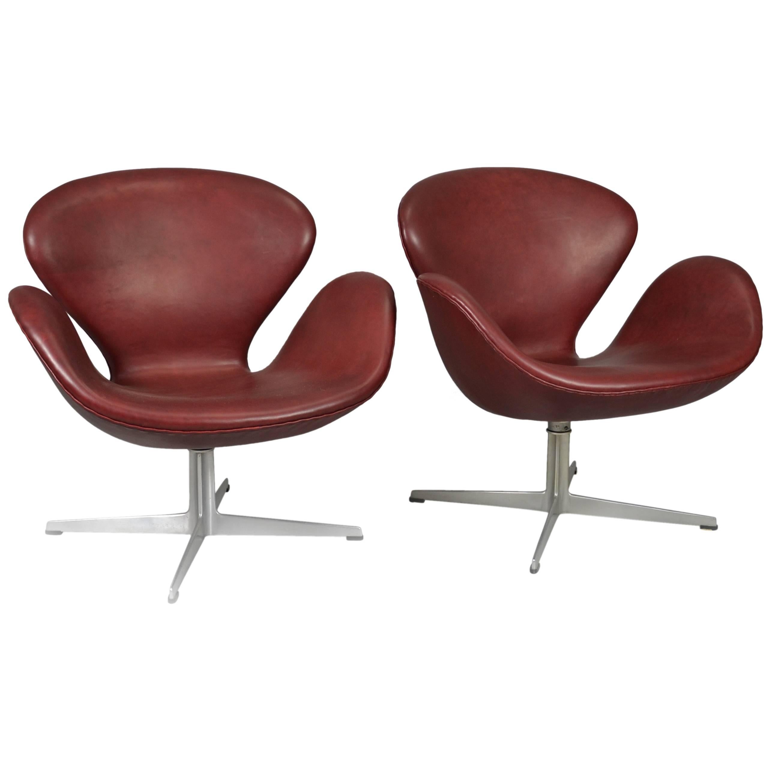 Pair of Swan Chairs by Arne Jacobsen in Bordeaux Leather