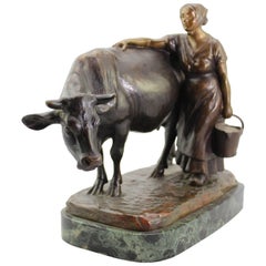 Antique Louis Riche Bronze of a Cow and Milking Woman, circa 1910