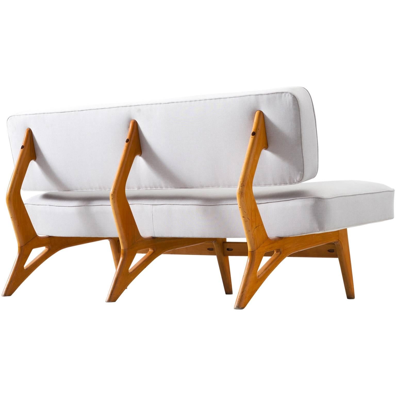 Sofa, in maple and fabric by Móveis Cimo, Brazil, 1950s. 

Small curved sofa with organic shaped maple base. Designed in the style of Brazilian designer Giuseppe Scapinelli. Eye catching element is the wooden frame. This organic shaped frame is