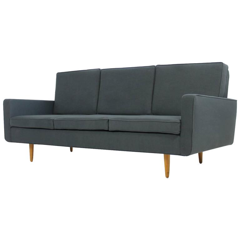 Beautiful Florence Knoll sofa in dark grey, very good condition, reupholstered and covered with woven fabric, beechwood legs and freestanding. A matching pair of lounge chairs is also available, please check out our storefront. Designed in, circa