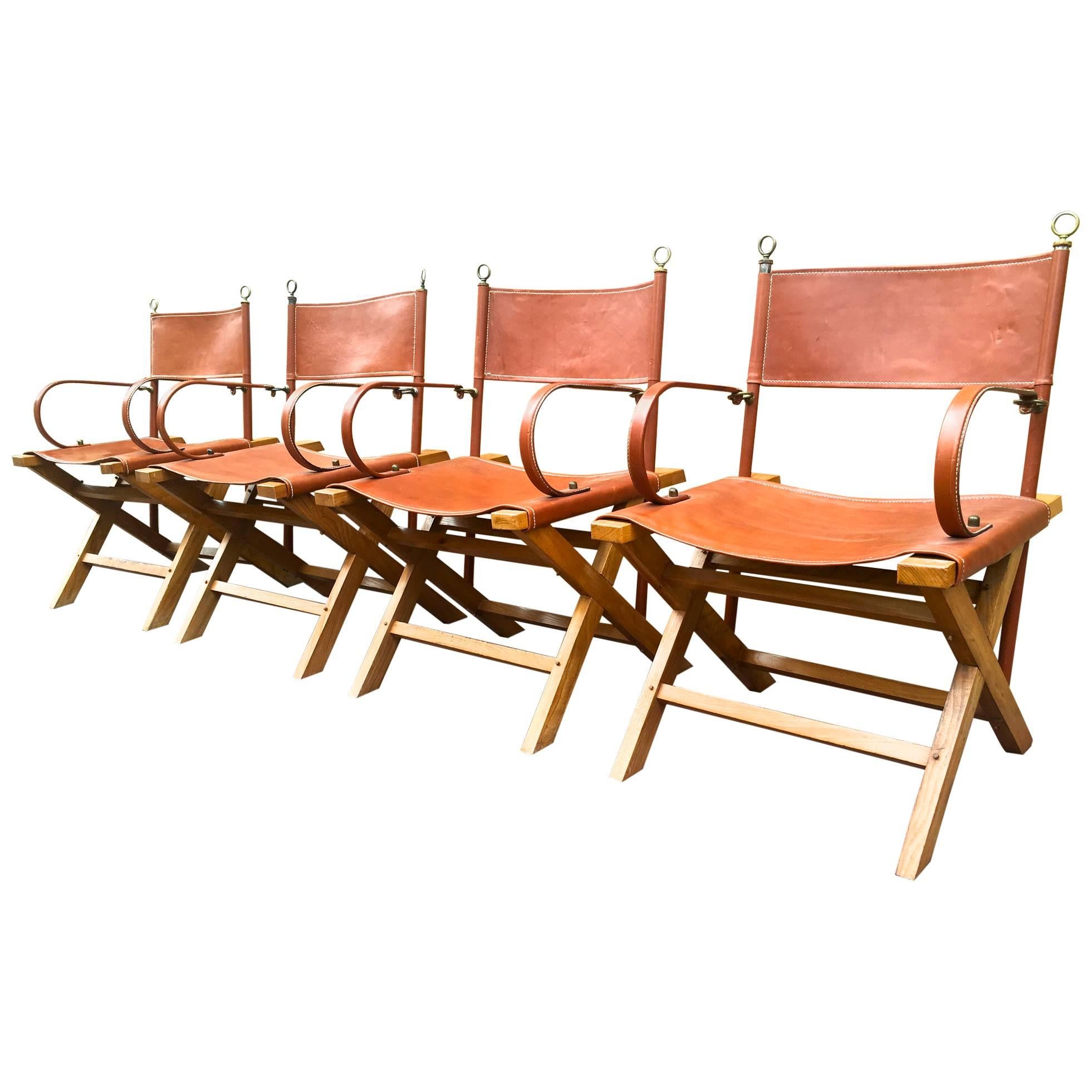 Jacques Adnet Rarest and Documented Four Armchairs Set in Hand-Stitched Leather For Sale