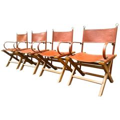Jacques Adnet Rarest and Documented Four Armchairs Set in Hand-Stitched Leather