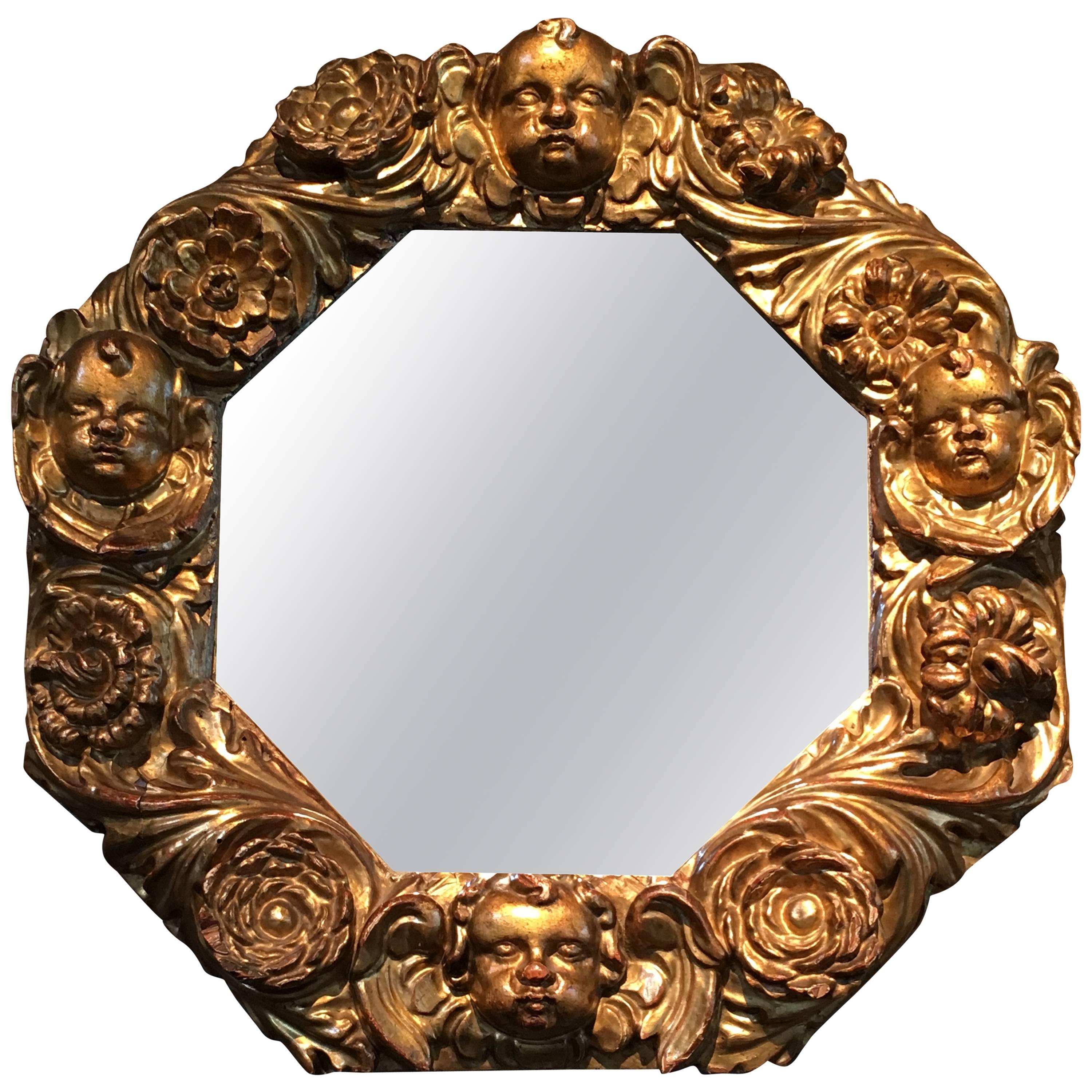 Giltwood Octagonal Mirror with Cherubs Heads, 17th Century For Sale