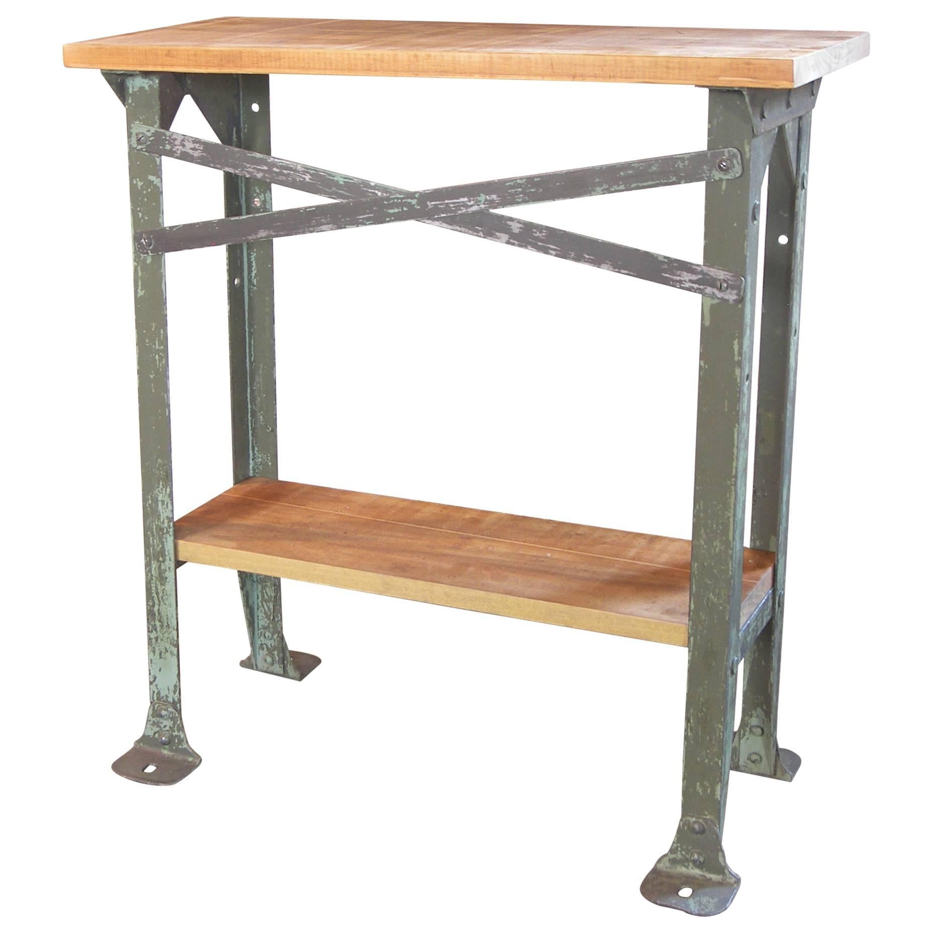 Vintage Industrial two-tier wood and metal side table, shelf, storage stand. Measures: 27 1/8″ x 12 1/8″. Overall height is 30″ bottom shelf height is 10″.