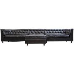 Grand Black Leather Tufted Sectional Sofa with Ottoman
