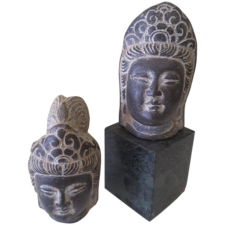 An Asian Pair of Buddha Stone Heads, Mixed Pair, Unmounted For Sale at