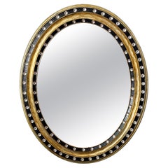 Irish Ebony and Gilt Oval Wall Mirror with Glass Studs (H 29 3/8 x W 23 5/8)