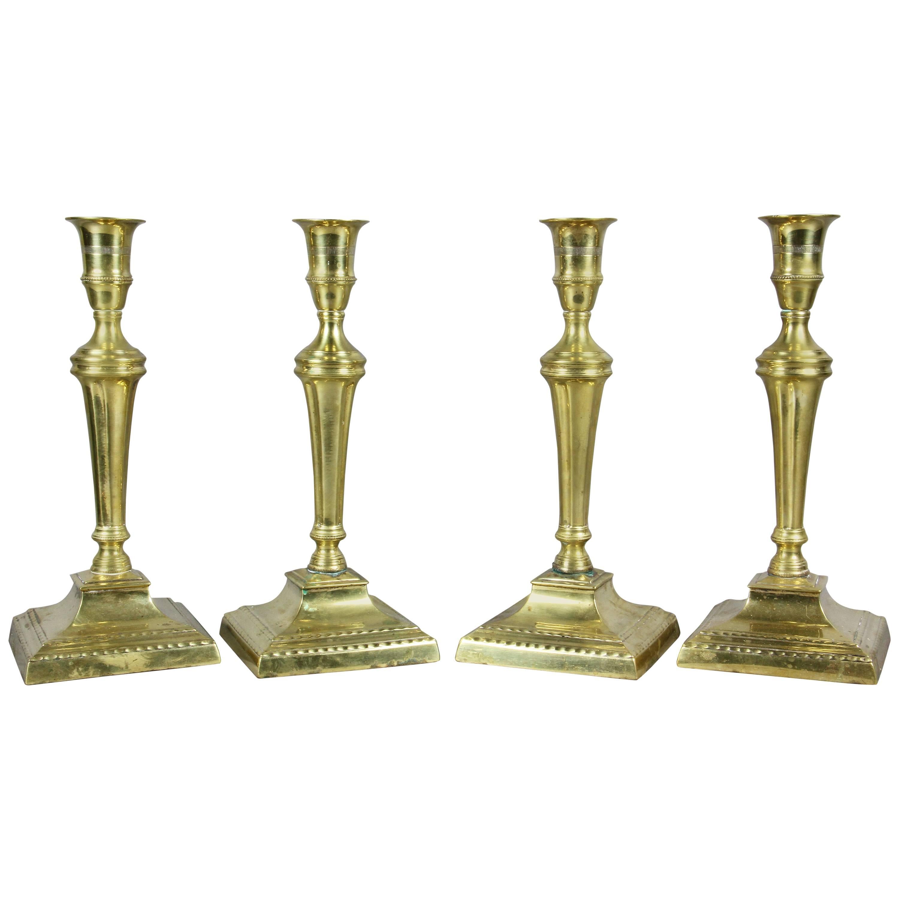Set of Four George III Brass Candlesticks