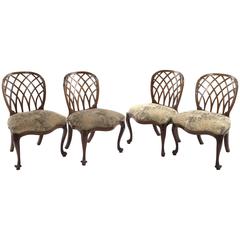 Set of Four George III Walnut Upholstered Pierced Back Chairs