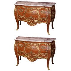 Pair of French Commodes with Marble Tops and Extensive Ormolu Mounts